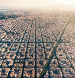 Aerial view of typical buildings of Barcelona cityscape from helicopter. top view, Eixample residencial famous urban grid